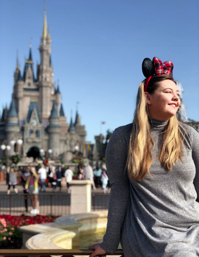 Woman posing in front of Cinderella's Castle