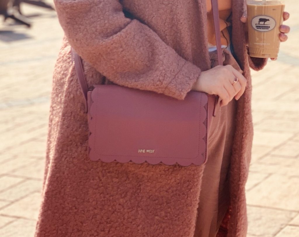 Woman holding pink bag